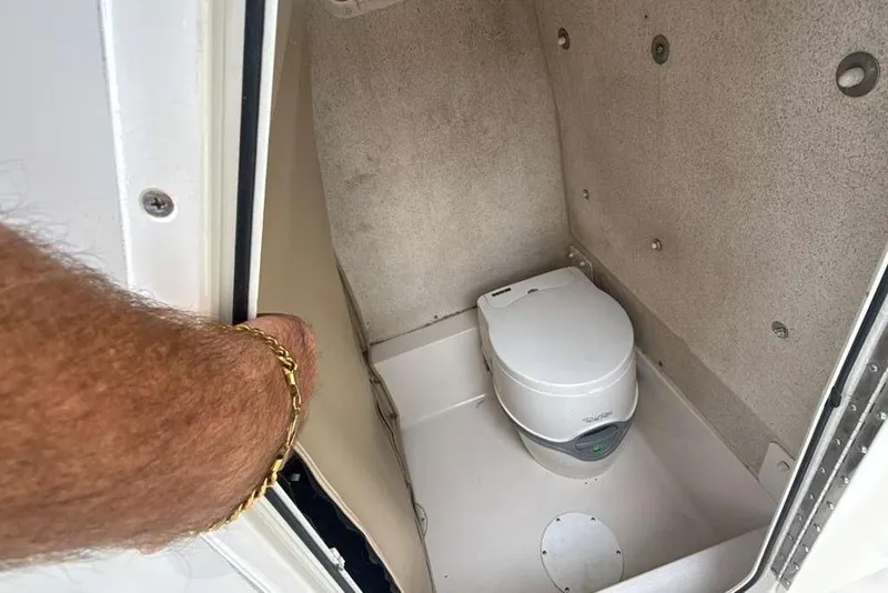 Slide: The Image of 2017 Sea Chaser 24 HFC boat interior with compact marine toilet. - 15