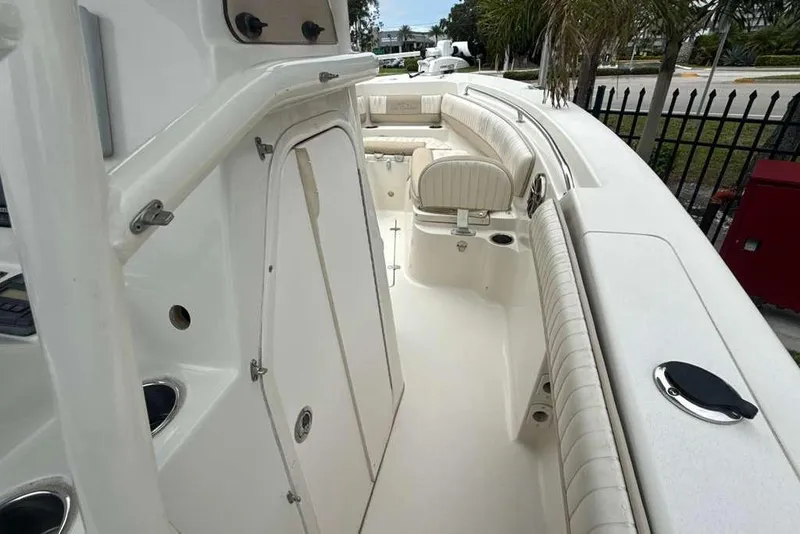 Slide: The Image of 2017 Sea Chaser 24 HFC boat interior with white seating and sleek design. - 16