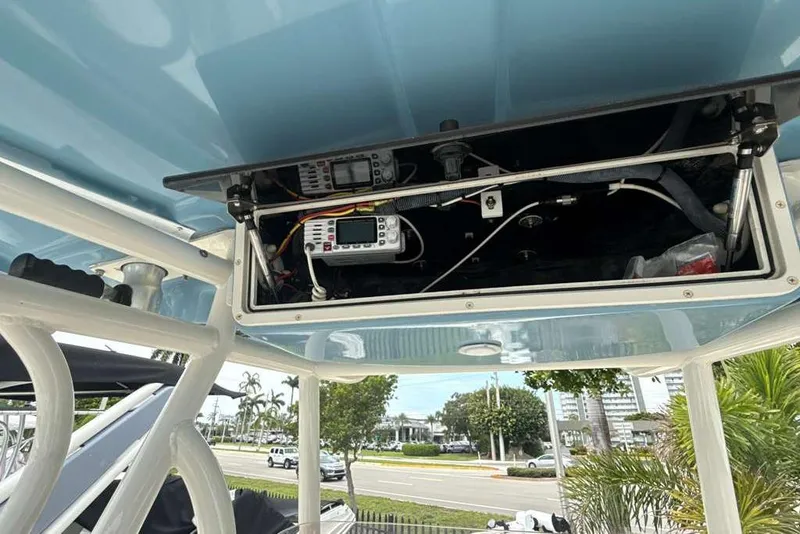 Slide: The Image of 2017 Sea Chaser 24 HFC boat electronics compartment with wiring and devices. - 17