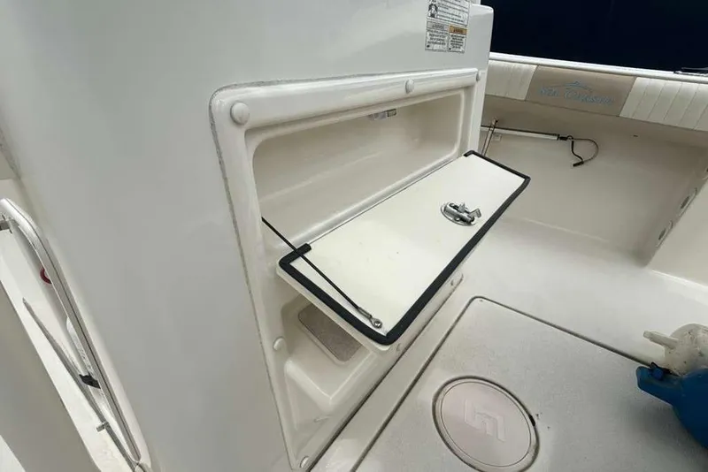 Slide: The Image of 2017 Sea Chaser 24 HFC boat storage compartment with open hatch. - 19