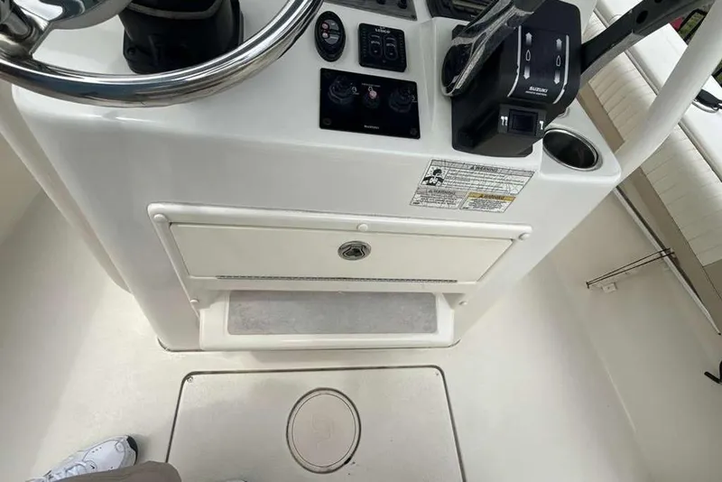 Slide: The Image of 2017 Sea Chaser 24 HFC boat console with steering wheel and controls. - 20