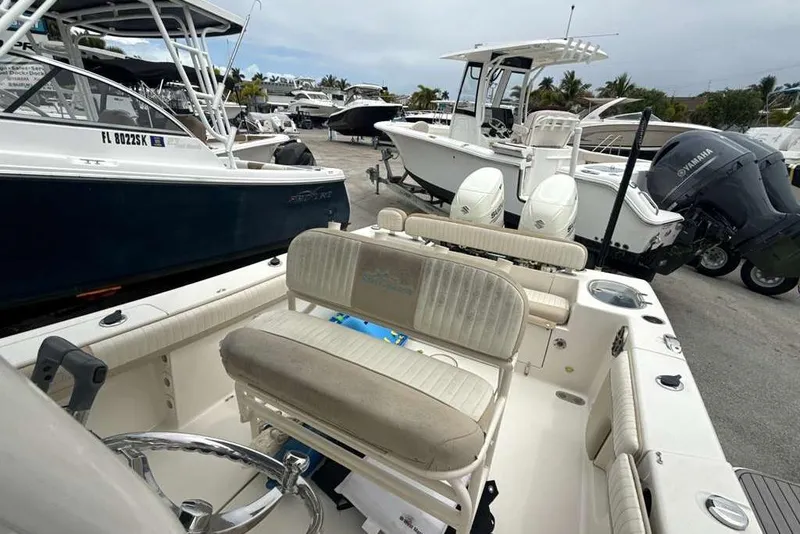 Slide: The Image of 2017 Sea Chaser 24 HFC boat with dual engines in a marina setting. - 21