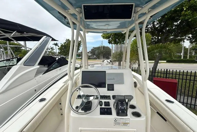 Slide: The Image of 2017 Sea Chaser 24 HFC boat dashboard with steering wheel and navigation equipment. - 25