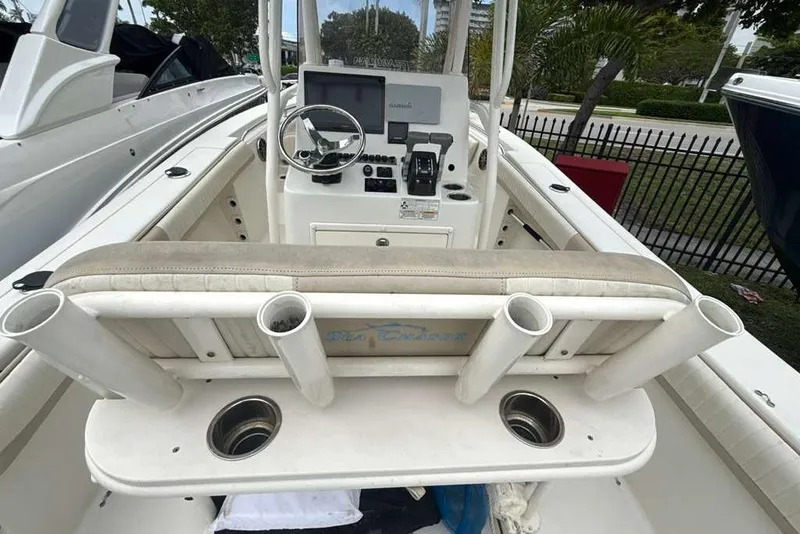Slide: The Image of 2017 Sea Chaser 24 HFC boat interior with steering console and rod holders. - 26