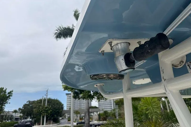 Slide: The Image of 2017 Sea Chaser 24 HFC boat detail with rod holder and blue canopy. - 27