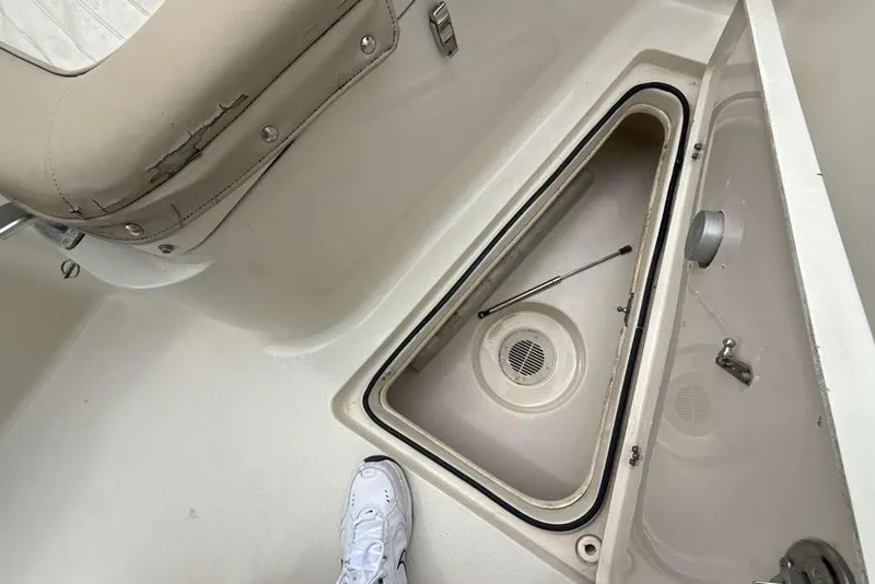 Slide: The Image of 2017 Sea Chaser 24 HFC boat interior with open storage compartment and seating. - 5