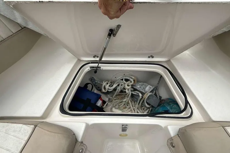 Slide: The Image of Storage compartment of 2017 Sea Chaser 24 HFC boat with ropes and gear. - 7
