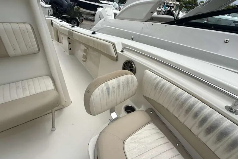 Slide: The Image of 2017 Sea Chaser 24 HFC boat interior with beige and white seating. - 9