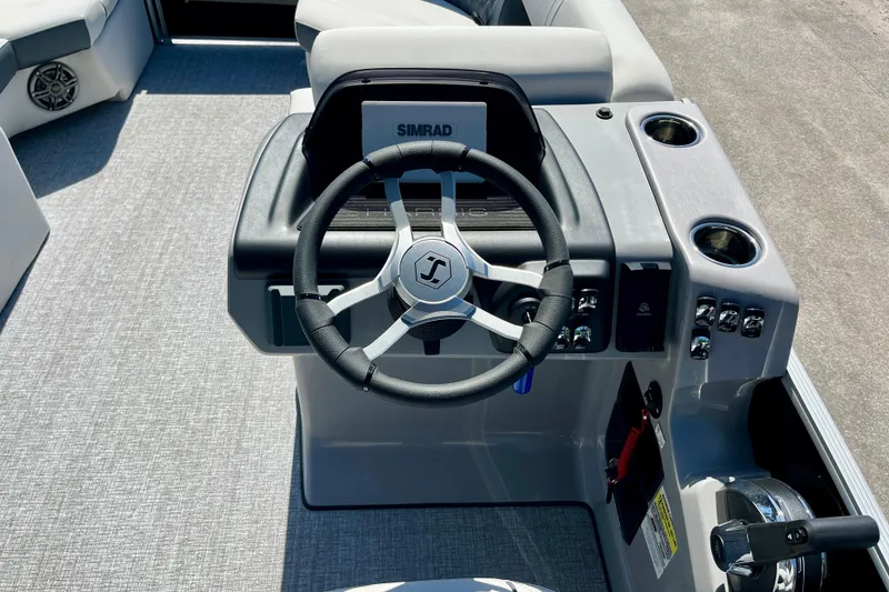 Slide: The Image of Steering wheel and console of Harris Sunliner 210, 2025 model. - 10