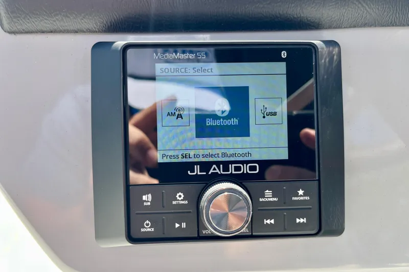 Slide: The Image of JL Audio MediaMaster 55 control on Harris Sunliner 210, year 2025. - 15