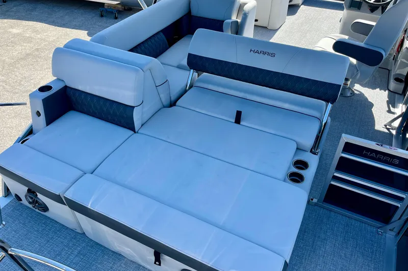 Slide: The Image of Harris Sunliner 210 2025 with luxurious blue seating area. - 17