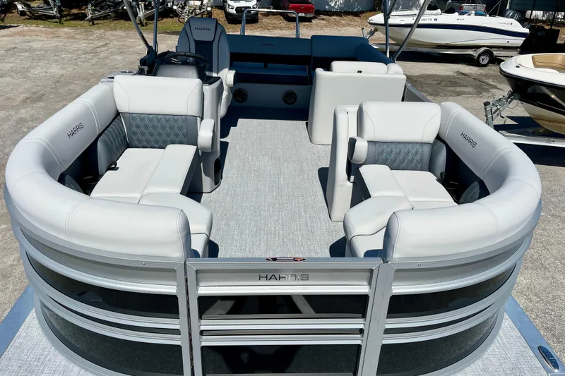 Slide: The Image of 2025 Harris Sunliner 210 pontoon boat with luxurious seating area. - 19