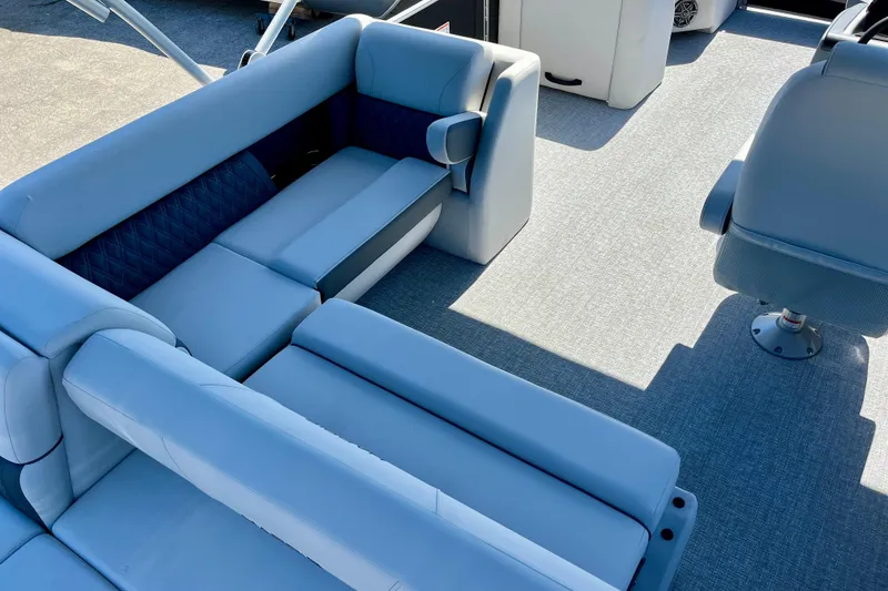 Slide: The Image of Interior of 2025 Harris Sunliner 210 pontoon boat with blue upholstery. - 9