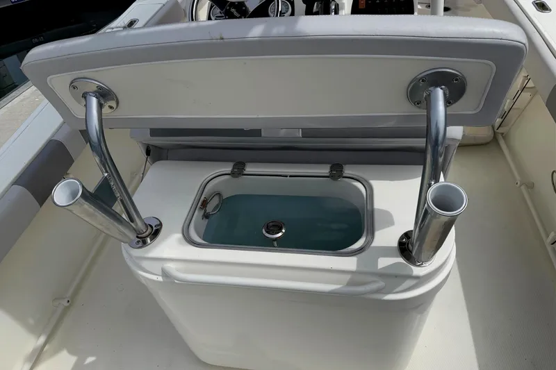 Slide: The Image of 2024 Mako 214 Center Console boat with livewell and rod holders. - 15