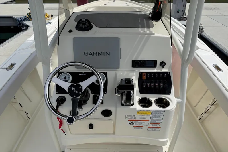 Slide: The Image of 2024 Mako 214 Center Console boat dashboard with Garmin navigation system. - 17