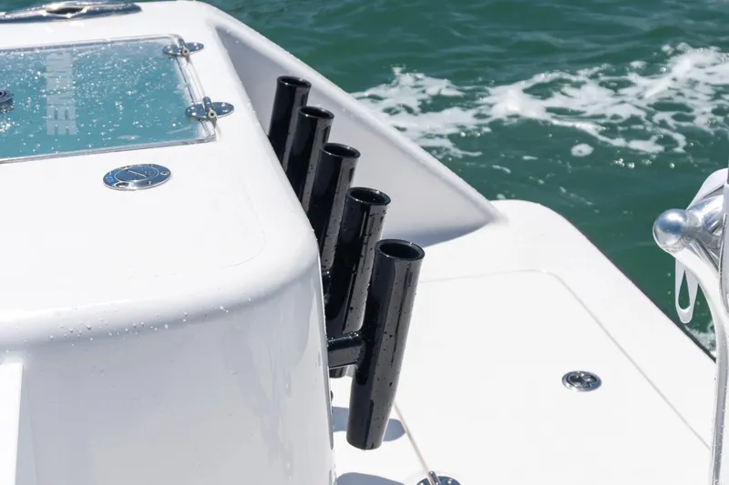 Slide: The Image of 2026 Twin Vee 340 GFX CC boat detail with rod holders and ocean backdrop. - 16