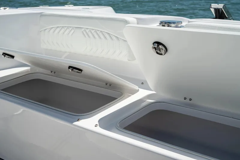 Slide: The Image of Open storage compartments on 2026 Twin Vee 340 GFX CC boat, showcasing sleek design. - 18