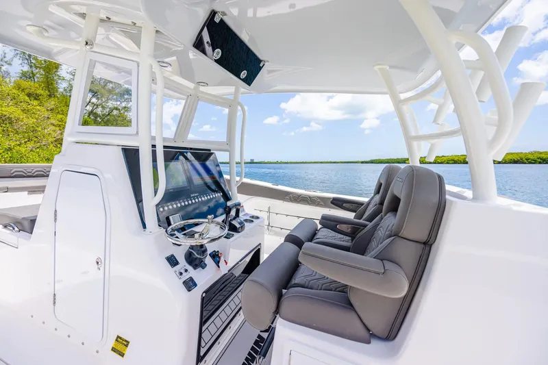 Slide: The Image of Interior of 2026 Twin Vee 340 GFX CC boat with modern helm and seating. - 7