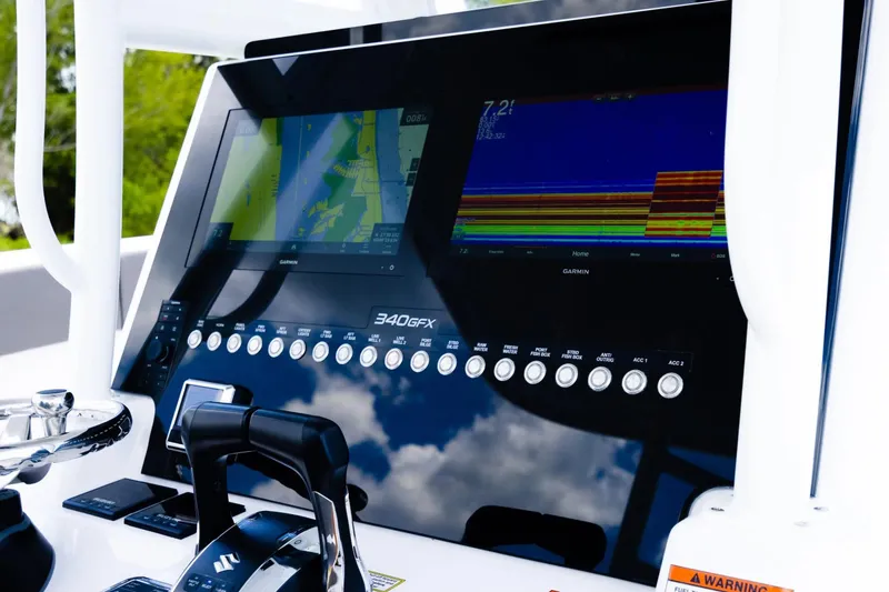 Slide: The Image of Dashboard of 2026 Twin Vee 340 GFX CC boat with navigation screens and controls. - 8