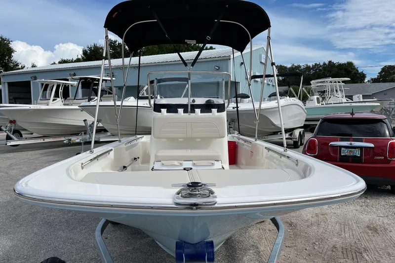 Slide: The Image of 2026 Boston Whaler 150 Montauk boat parked outdoors. - 3