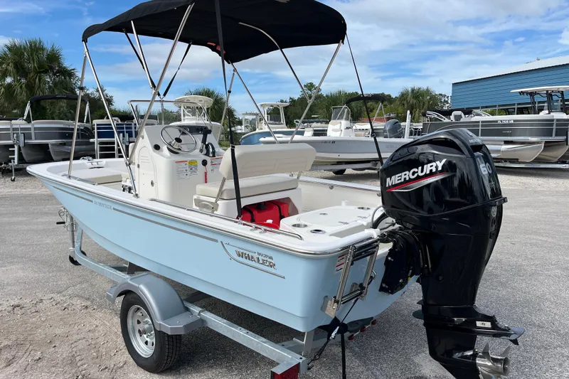 Slide: The Image of 2026 Boston Whaler 150 Montauk with Mercury engine on trailer. - 6
