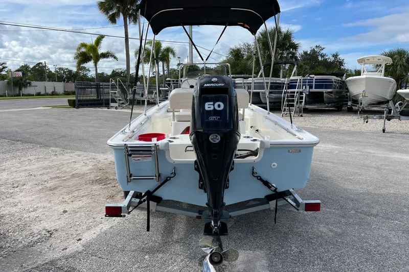 Slide: The Image of Rear view of 2026 Boston Whaler 150 Montauk with Mercury 60 HP engine. - 7