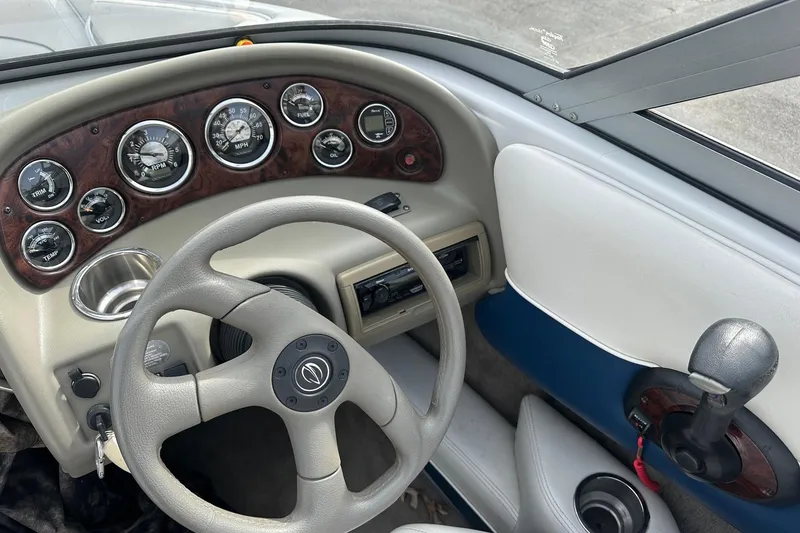 Slide: The Image of 2007 Crownline 19 SS boat dashboard with steering wheel and instrument panel. - 12