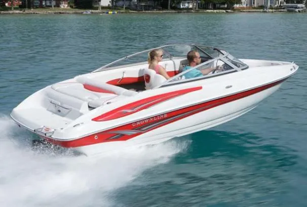 Slide: The Image of 2007 Crownline 19 SS boat cruising on blue water. - 13