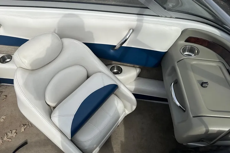 Slide: The Image of Interior of a 2007 Crownline 19 SS boat with white and blue seating. - 6