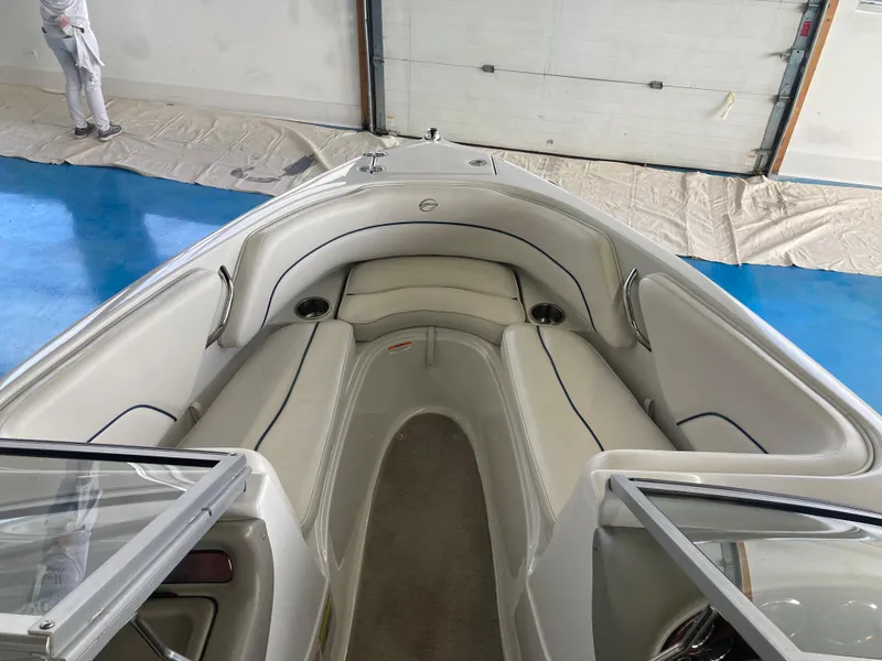 Slide: The Image of Interior view of a 2007 Crownline 19 SS boat with beige seating. - 8