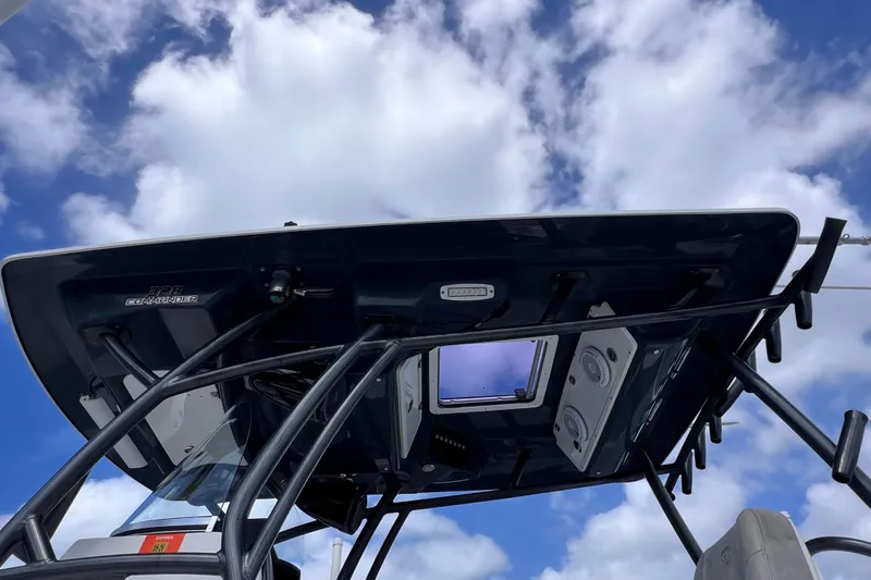 Slide: The Image of 2019 Sea Fox 328 Commander boat roof against a cloudy sky. - 14