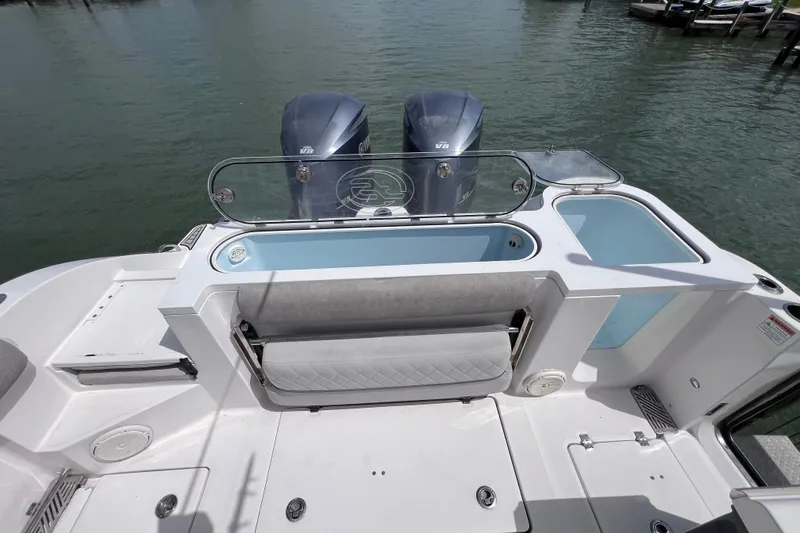 Slide: The Image of 2019 Sea Fox 328 Commander boat deck with dual engines and seating area. - 20