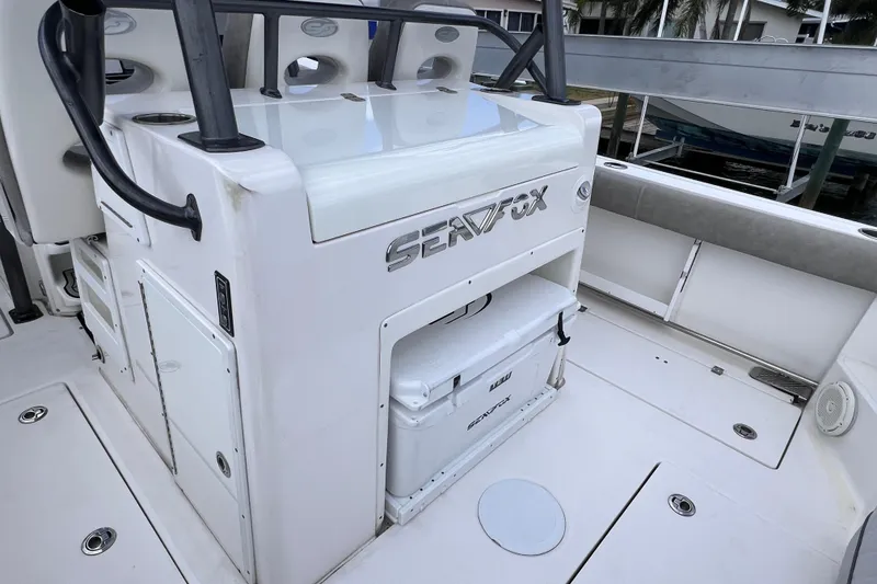 Slide: The Image of 2019 Sea Fox 328 Commander boat interior with seating and storage compartments. - 23