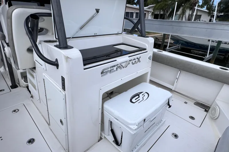 Slide: The Image of 2019 Sea Fox 328 Commander boat interior with storage and seating area. - 25