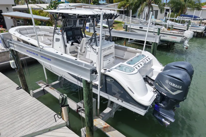 Slide: The Image of 2019 Sea Fox 328 Commander boat on lift with dual Yamaha engines. - 3