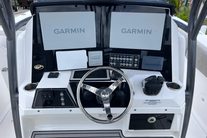 Slide: The Image of 2019 Sea Fox 328 Commander helm with Garmin displays and controls. - 31