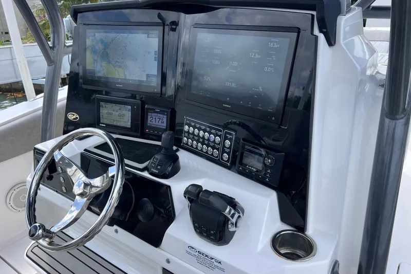Slide: The Image of 2019 Sea Fox 328 Commander dashboard with navigation screens and controls. - 34
