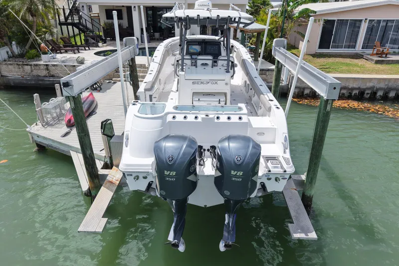 Slide: The Image of 2019 Sea Fox 328 Commander boat docked with dual Yamaha V8 engines. - 4