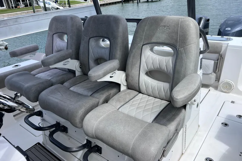 Slide: The Image of Luxurious seating on a 2019 Sea Fox 328 Commander boat, featuring plush gray upholstery. - 45