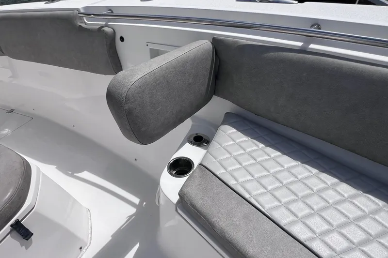 Slide: The Image of 2019 Sea Fox 328 Commander boat interior with cushioned seating and cup holders. - 49