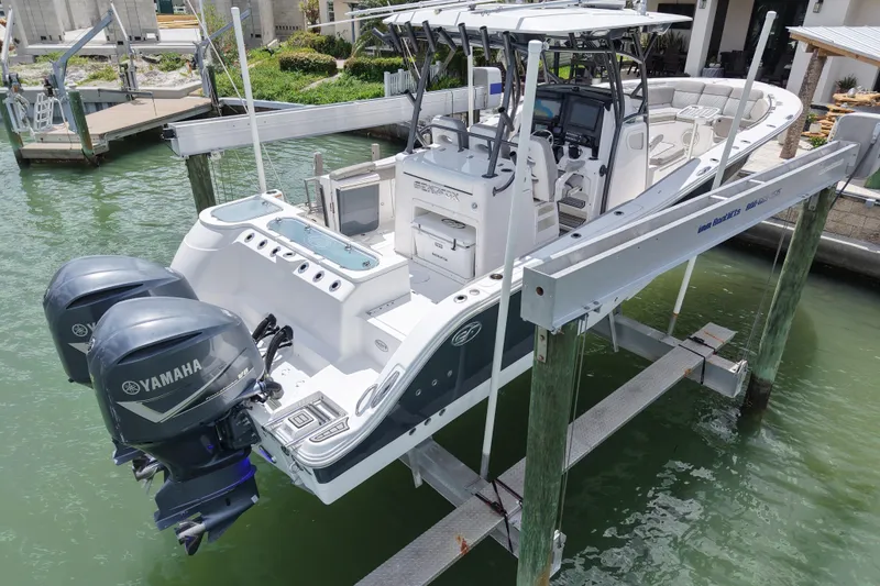 Slide: The Image of 2019 Sea Fox 328 Commander boat with Yamaha engines on a lift. - 5