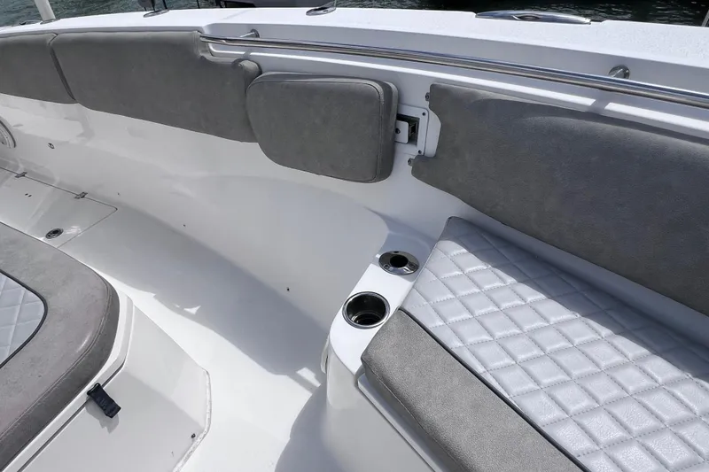 Slide: The Image of 2019 Sea Fox 328 Commander boat interior with cushioned seating and cup holders. - 50