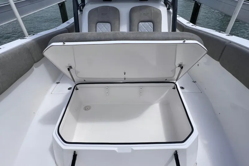 Slide: The Image of Open storage compartment on a 2019 Sea Fox 328 Commander boat deck. - 52