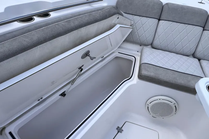 Slide: The Image of 2019 Sea Fox 328 Commander boat interior with open storage compartment and cushioned seating. - 53