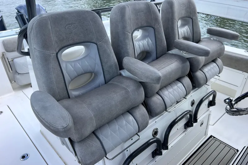 Slide: The Image of Luxurious seating on 2019 Sea Fox 328 Commander boat, featuring plush gray upholstery. - 59