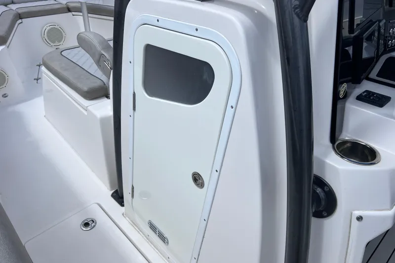 Slide: The Image of 2019 Sea Fox 328 Commander boat interior with seating and storage compartment. - 61