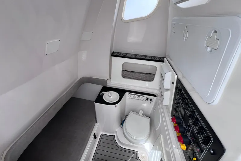 Slide: The Image of Interior of 2019 Sea Fox 328 Commander boat featuring a compact marine toilet. - 62