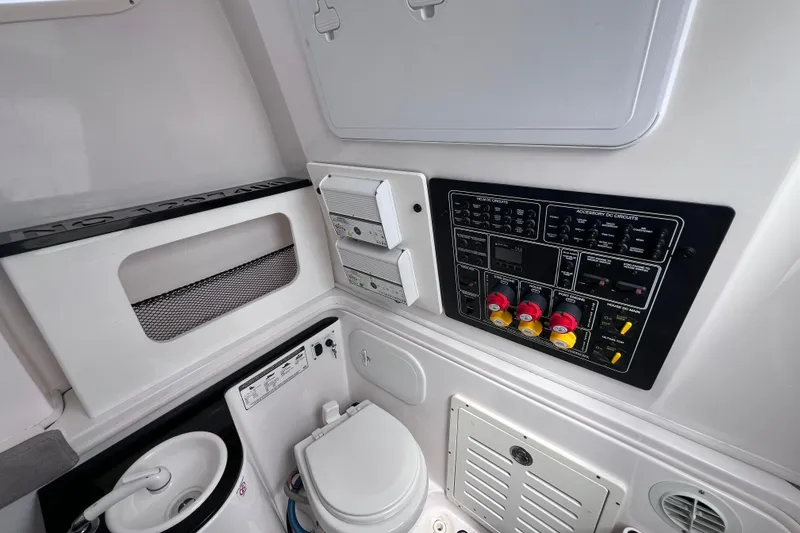 Slide: The Image of Interior of 2019 Sea Fox 328 Commander featuring control panel and marine toilet. - 63