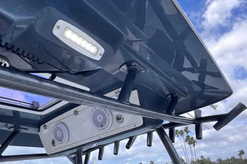Slide: The Image of 2019 Sea Fox 328 Commander boat roof with speakers and LED lights under blue sky. - 71