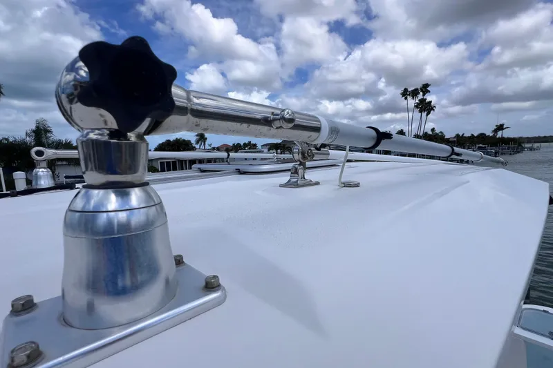 Slide: The Image of 2019 Sea Fox 328 Commander boat deck with mounted equipment under cloudy sky. - 79